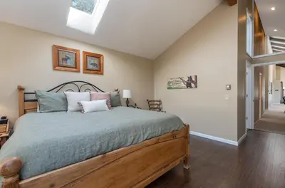 a bedroom with a large bed in a room at Cedar Upper Condominium 3 Bedroom condo in Estes Park