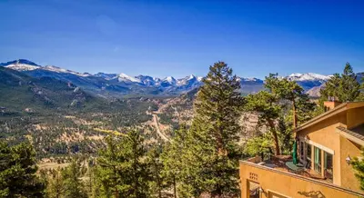 a view of the mountains from a building at Cedar Upper Condominium 3 Bedroom condo in Estes Park