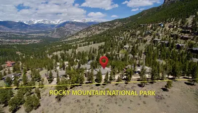 a view of a park with a red marker on a mountain at Werlein Condominium 4 Bedroom condo in Estes Park