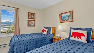 a bedroom with two beds and a window at Werlein Condominium 4 Bedroom condo in Estes Park