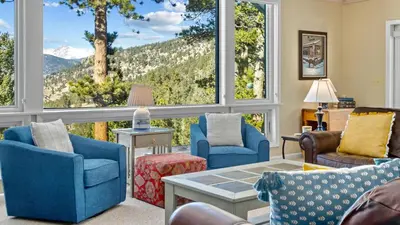 a living room with a view of a mountain at Werlein Condominium 4 Bedroom condo in Estes Park
