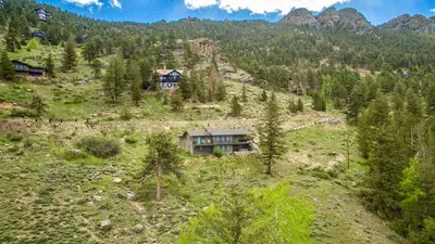 an aerial view of a house on a mountain at Stevenson Home in Estes Park