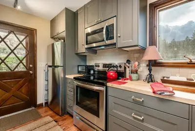 a kitchen with stainless steel appliances and a window at Stevenson Home in Estes Park