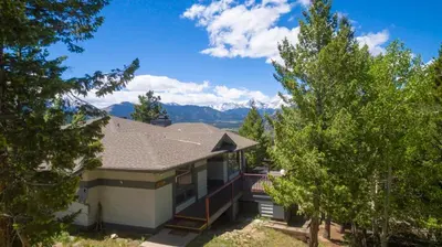 a house with a view of the mountains at Griffin Family Condominium 4 Bedroom condo in Estes Park