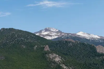 a mountain with snow on top of it at Alleman North Condominium 3 Bedroom condo in Estes Park