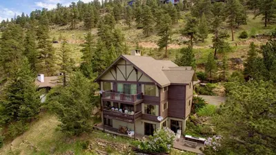 an aerial view of a large house on a hill at Alleman North Condominium 3 Bedroom condo in Estes Park