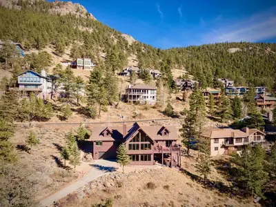 an aerial view of a house in a mountain at Awestruck Home in Estes Park