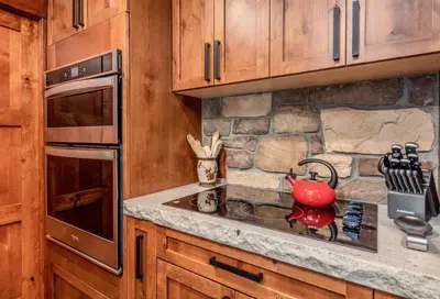 a kitchen with a red tea kettle on a stove at Breiding Upper Condominium 2 Bedroom condo in Estes Park