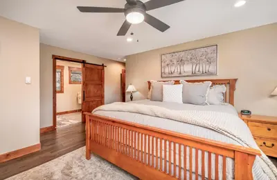 a bedroom with a bed and a ceiling fan at Breiding Upper Condominium 2 Bedroom condo in Estes Park