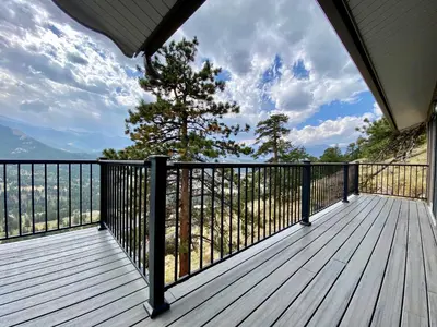 a deck with a view of the mountains at Breiding Upper Condominium 2 Bedroom condo in Estes Park