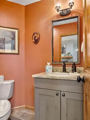 a bathroom with a sink and a mirror at Dances With Wolves Condominium 3 Bedroom condo in Estes Park