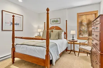 a bedroom with a bed and a desk and a chair at Dances With Wolves Condominium 3 Bedroom condo in Estes Park