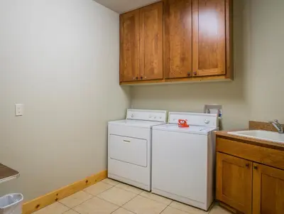 a kitchen with a white dishwasher and a sink at Serenity Condominium 3 Bedroom condo in Estes Park