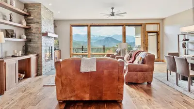 a living room with a couch and a fireplace at Serenity Condominium 3 Bedroom condo in Estes Park