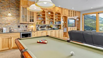 a kitchen with a pool table in a room at Garlands' Alpine Lodge Condominium 3 Bedroom condo in Estes Park