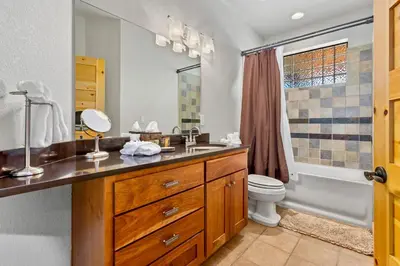 a bathroom with a sink and a toilet at Garlands' Alpine Lodge Condominium 3 Bedroom condo in Estes Park