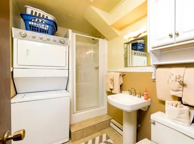 a small bathroom with a sink and a refrigerator at Kintzle Home in Estes Park