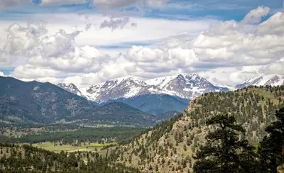 a view of a mountain range with snow covered mountains at Kintzle Home in Estes Park