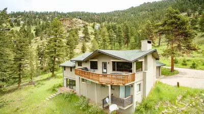 an aerial view of a house with a balcony at Salmans Bear Cove Home in Estes Park