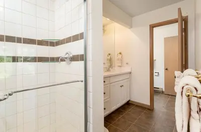 a bathroom with a shower and a sink at Adams Condominium 2 Bedroom condo in Estes Park