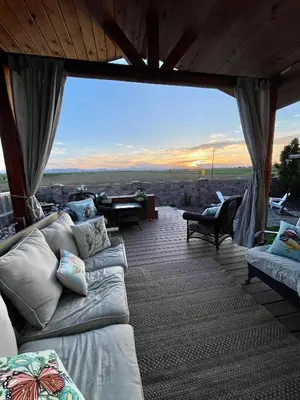 a living room with couches and a large glass window at Launch Pad 2 Denver, Boulder & Mountains in Lafayette