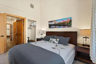 a bedroom with a large bed in a room at Spacious Dtwn Estes Park Loft Condo 4 Mi to RMNP in Estes Park