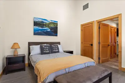 a bedroom with a bed in a room at Spacious Dtwn Estes Park Loft Condo 4 Mi to RMNP in Estes Park