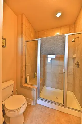 a bathroom with a shower and a toilet at Luxury in Downtown Winter Park СО in Winter Park