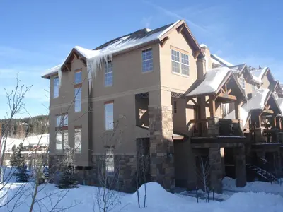 a large house with snow on the ground at Luxury in Downtown Winter Park СО in Winter Park