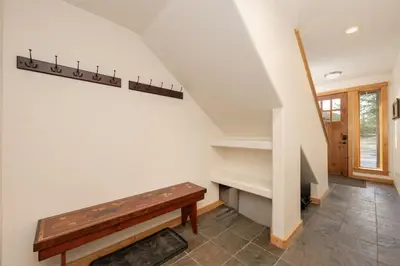 a staircase with a bench in a house at 102 Willows Way Townhouse in Winter Park