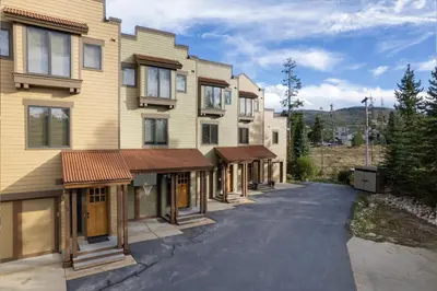 an empty street in front of a building at 102 Willows Way Townhouse in Winter Park