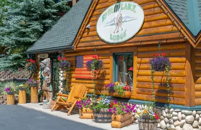 a log cabin building with a sign on it at Spirit Lake Lodge in Grand Lake