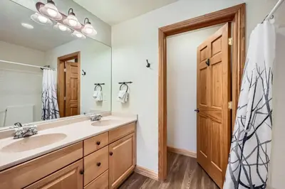 a bathroom with a sink and a mirror at Hidden River Lodge 5945 - Keystone in Keystone