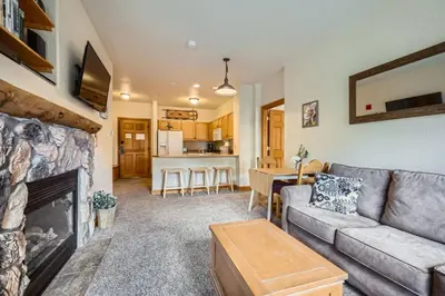 a living room with a couch and a fireplace at Hidden River Lodge 5945 - Keystone in Keystone