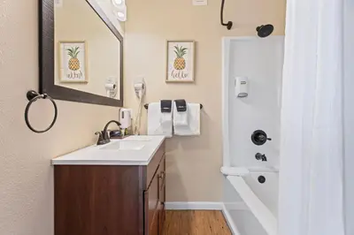 a bathroom with a sink and a mirror at Coyote Mountain Lodge in Estes Park