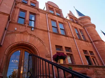 a brick building with an archway on it at Patterson Inn in Denver