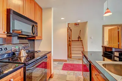 a kitchen with a stove and a sink at Highland Greens Lodge 305 Condo in Breckenridge