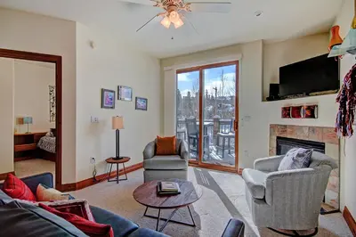 a living room filled with furniture and a fireplace at Highland Greens Lodge 305 Condo in Breckenridge