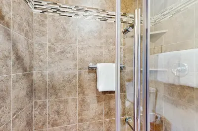 a bathroom with a shower with a glass door at Settler's Creek 6524 in Keystone