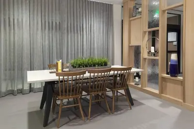 a dining room with a table and chairs at Fairfield Inn & Suites by Marriott Fort Collins South in Fort Collins
