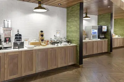 a large kitchen with wooden counters and appliances at Fairfield Inn & Suites by Marriott Fort Collins South in Fort Collins