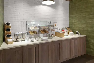 a bakery counter with pastries and other food items at Fairfield Inn & Suites by Marriott Fort Collins South in Fort Collins