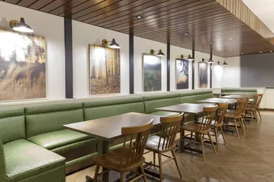 a row of tables and chairs in a restaurant at Fairfield Inn & Suites by Marriott Fort Collins South in Fort Collins