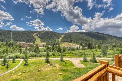 a view from the deck of a house with a mountain at Tenderfoot Lodge 2621 in Keystone