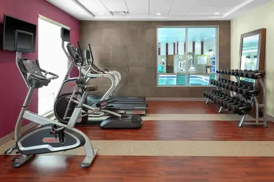 a fitness room with treadmills and a gym at Home2 Suites By Hilton Denver South Centennial Airport in Centennial