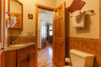 a bathroom with a toilet and a sink at The Twin Owls 21A Condo in Estes Park