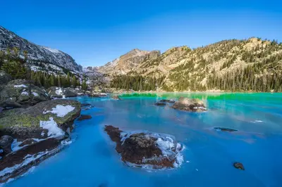 a view of a blue lake in the mountains at The Twin Owls 21A Condo in Estes Park