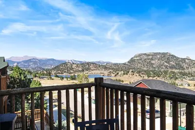 a view of the mountains from the balcony of a house at Mount Chiquita 10A Condo in Estes Park