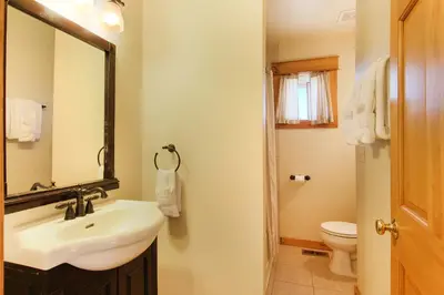 a bathroom with a sink and a toilet at Comanche Peak 39 Condo in Estes Park