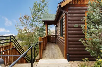 a stairway leading to a log cabin at Mount Cairns 16A Condo in Estes Park